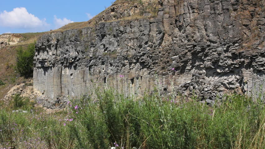 Beautiful landscape, rock mountains and green grass and blue sky