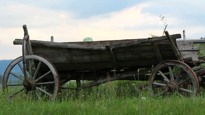 Happy bay play in old wooden cart
