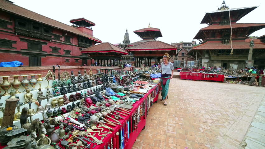 Female tourist choosing souvenir at Patan Durbar Square, Kathmandu, Nepal