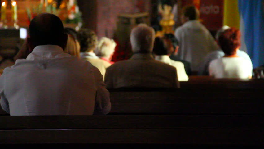 People sit down on benches in church waiting for ceremony | Shutterstock HD Video #5082563