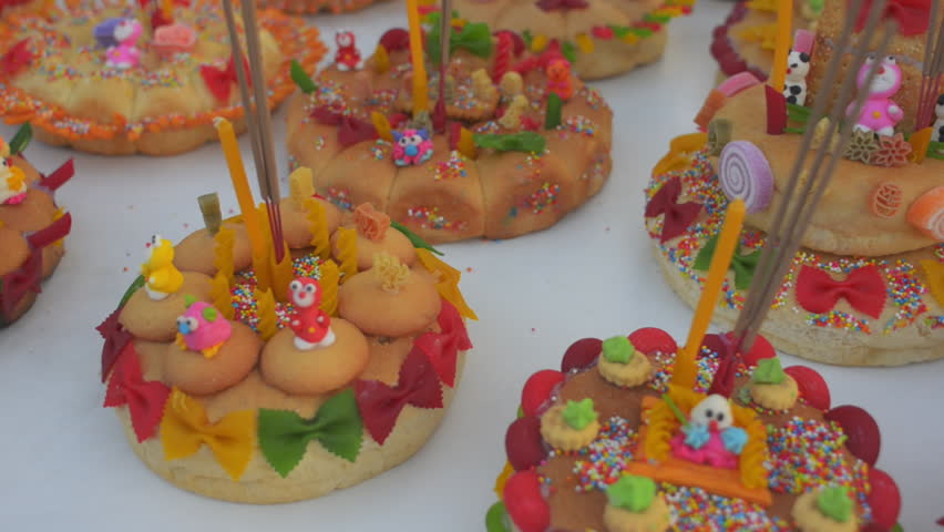 Bread krathongs covered in candy and fun decorations, setup at a stall ready to