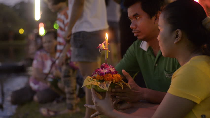 BANGKOK, THAILAND - NOVEMBER 17, 2013: A young Thai couple praying together,