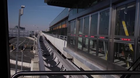Time lapse shot of airport tram going from station to station.