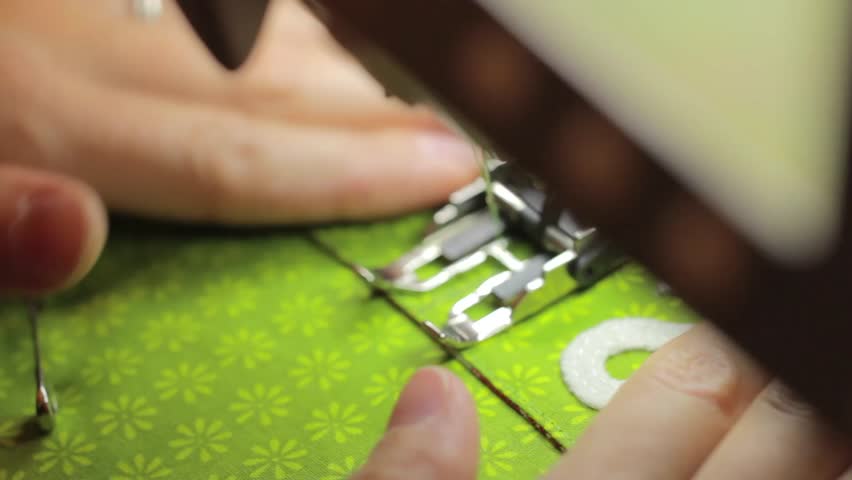 A woman sewing together an advent calendar