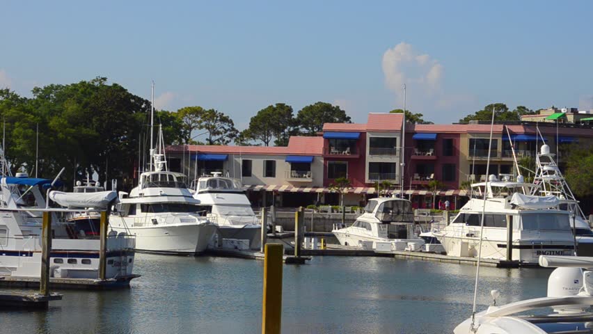 Hilton Head South Carolina the pier with yachts at Harbour Town with famous red and white lighthouse and boats