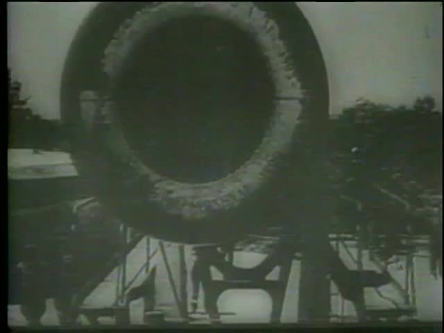 Closeup of a american WWI cannon muzzle flaming as it fires, circa 1917-1918 - MGM PICTURES, UNIVERSAL-INTERNATIONAL NEWSREEL, USA, filmed in 1964