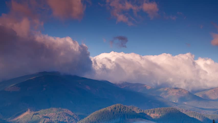 Time lapse clip. Fantastic mountain landscape with colorful cloud. Dramatic sky.