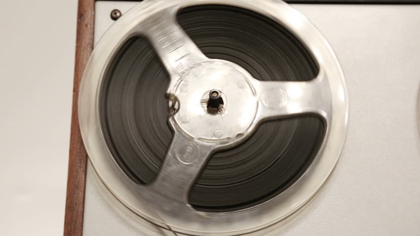 old reel tape recorder with spinning reels - dolly shot