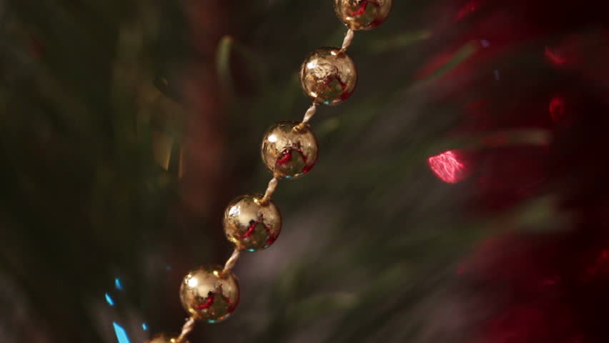 decorated christmas tree with flashing garlands macro