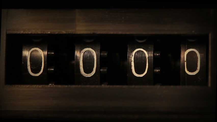 old mechanical counter quickly counts numbers - macro