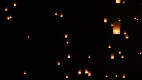 Floating lanterns in Yee Peng Festival, Loy Krathong celebration in Chiangmai, Thailand. Tele zoom angle view.