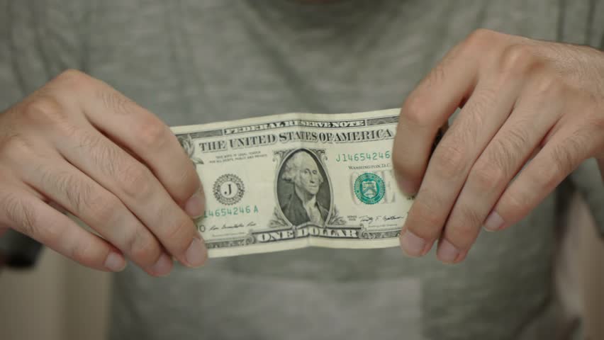 Male hands showing a $1 american bill