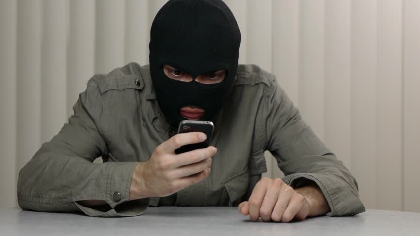 Hacker using a smartphone iPhone device that may be stolen. Great video for and