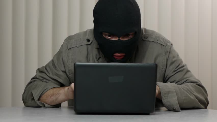 Hacker theft working with a laptop computer. Great video for and project