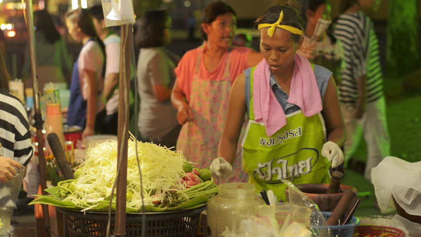 BANGKOK, THAILAND - NOVEMBER 2013: A Thai street vendor preparing to make Som