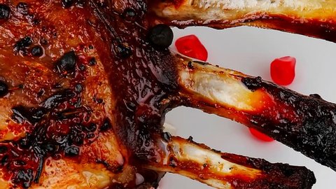 ribs served on plate with pomegranate seeds1920x1080 intro motion slow hidef hd