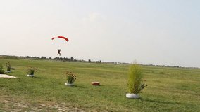 fly and landing of parachutists against the clear sky
shooting parachute jumps (skydiving) from a distance