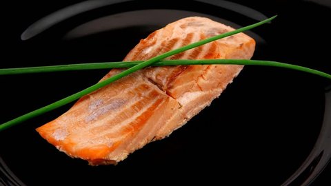 sea food : roasted pink salmon fillet with chinese onion on black dish 1920x1080 intro motion slow hidef hd