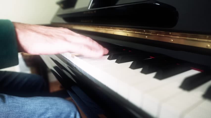 A man plays the piano