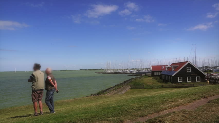 Tranquil senior people enjoying the orizon view of the majestic baltic sea 
