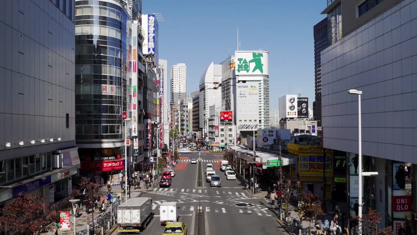 TOKYO, JAPAN - November 8 : Time lapse of a busy street with traffic of Shinjuku