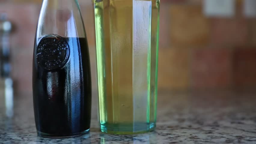 Glass containers with olive oil and balsamic vinegar