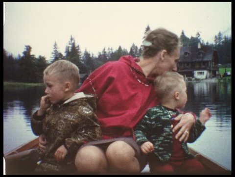 Rowing on mountain lake (vintage 8 mm film from the 1960s)