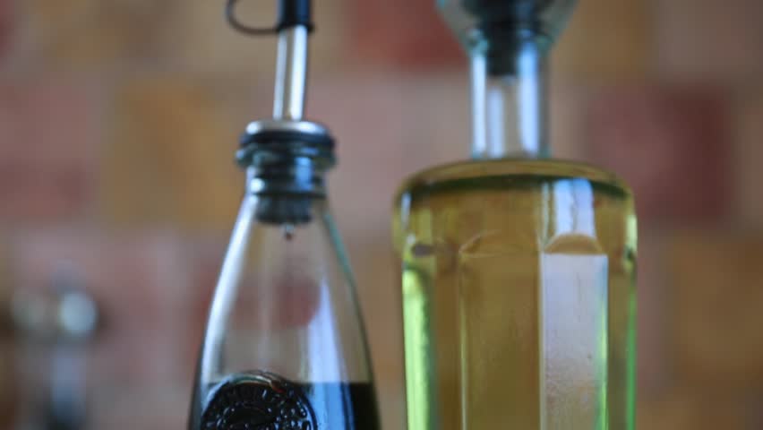 Clear glass bottles of Olive Oil and Balsamic Vinegar