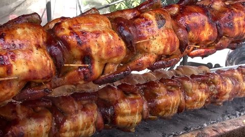 Barbecue Chicken. Whole chickens on a spit at a roadside stall. Taken in Thailand.  4/5