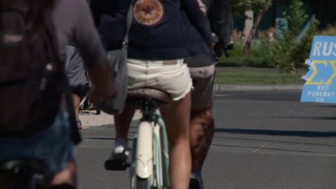 Students coeds on bicycle bikes near school college campus HD high definition stock video footage clip 1920x1080 1080