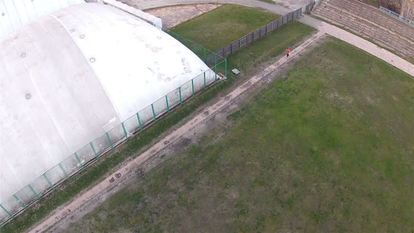 Old stadium with a  people  silhouette. Aerial