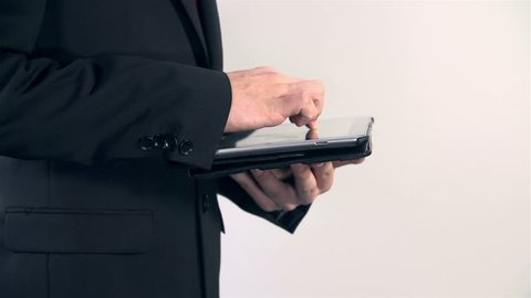 Close up side shot of man working on tablet PC