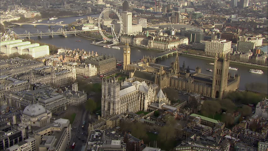 Aerial view of the famous landmark Big Ben and Houses of Parliament in London's city of Westminster, situated by the side of the river thames Royalty-Free Stock Footage #5166668
