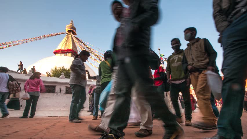 KATHMANDU, NEPAL - DEC 2: Timelapse: Unidentified pilgrims circle stupa