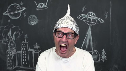 Man screaming with tinfoil helmet on