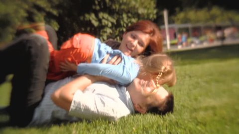 Stock Video Footage  Happy family playing in the park