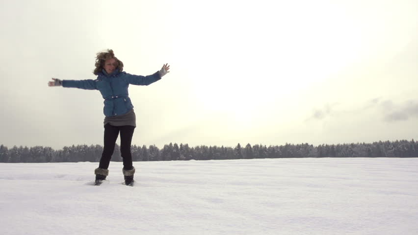 Beautiful Slow Motion Of Young Woman Doing A Cartwheel Outdoors In Snow On A
