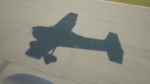 small airplane take off shadow aerial view