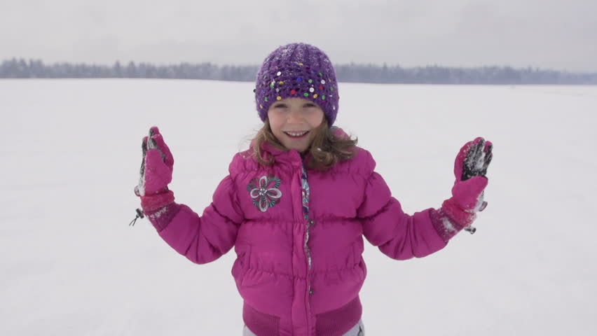 Slow Motion Of Cute Girl In Pink Parka Clapping Her Hands 
