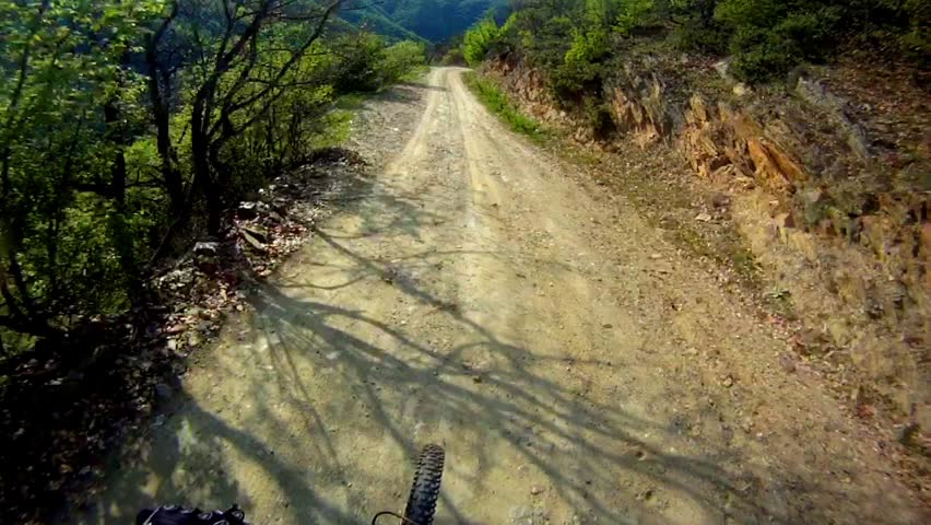 Mountain Bike Video: Downhill Track on the Alps - Stock Video. Fast mooving