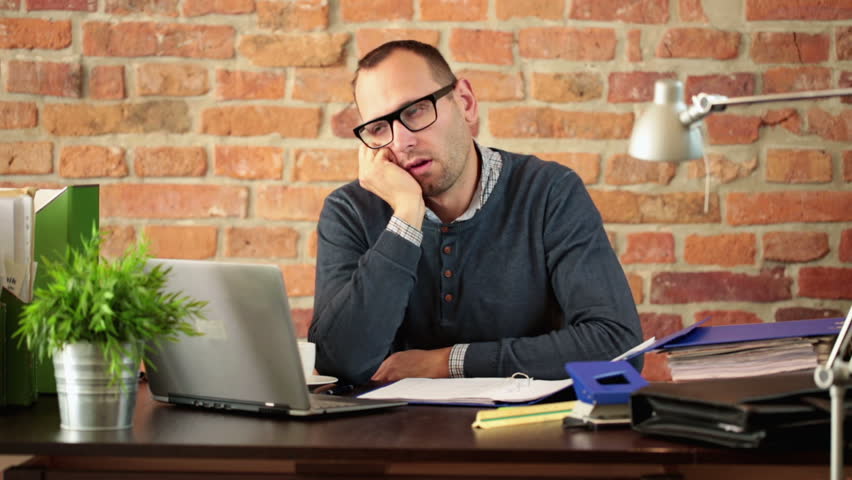 Tired man taking a nap in the office
 | Shutterstock HD Video #5185409