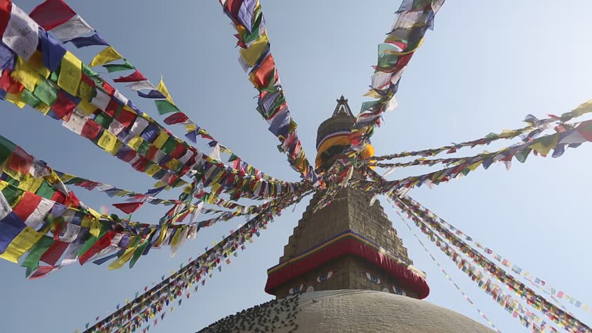 Prayer flags flying from the Boudhanath Stupa, a place of holy worship
