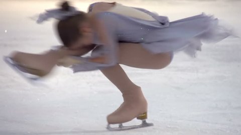 Element of Figure Skating. Little girl performs an element of figure skating "Spinner" 