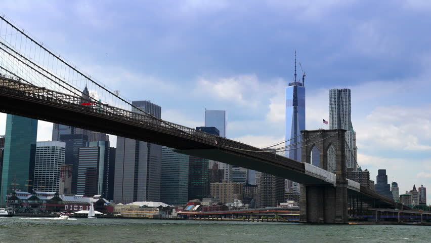 Time lapse of the Brooklyn bridge and the East River with Manhattan and the