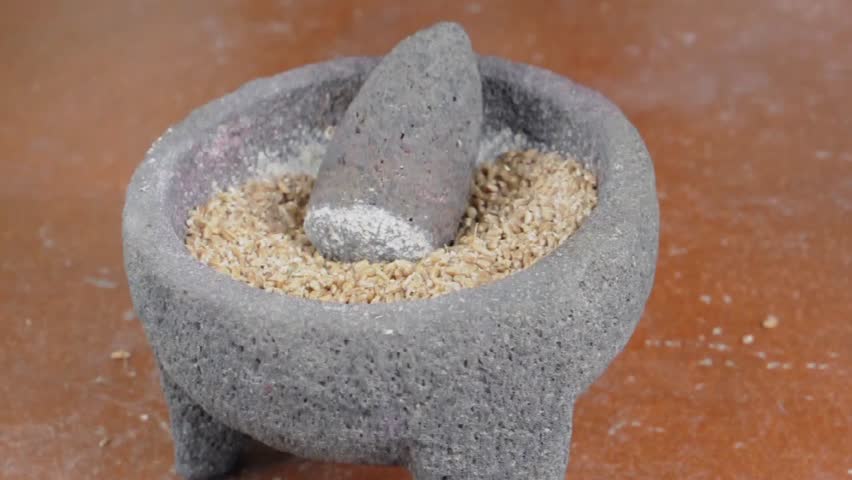 Grind stone. Stone Grinders. Grind Stone c. Milling flour by hand using Stone Grinders photo. Grind Stone in MC.