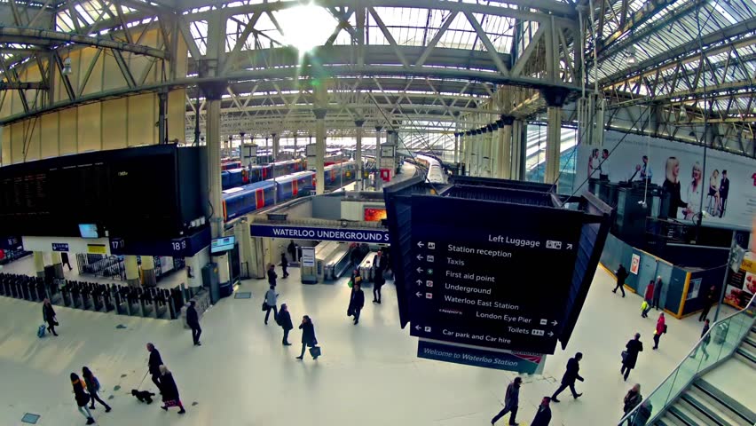 LONDON, UNITED KINGDOM - DECEMBER 9, 2013: Top view zoom timelapse of Commuters