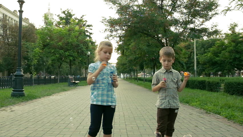 Two child have fun in park, outdoors