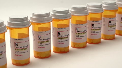 slider shot of medication bottles in a row
