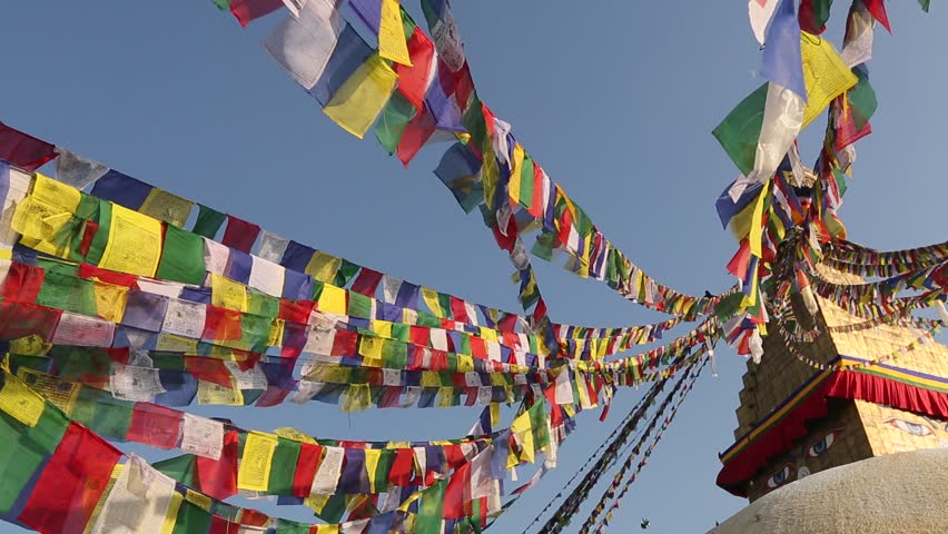 Prayer flags flying from the Boudhanath Stupa, a place of holy worship