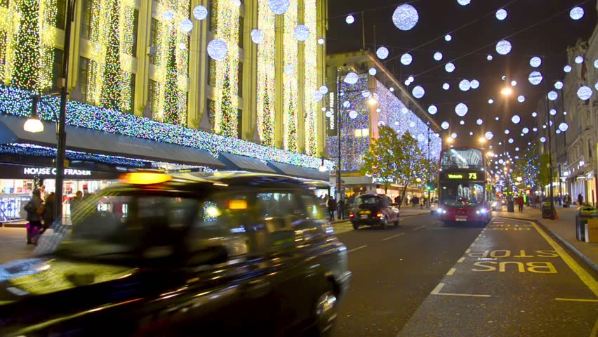 LONDON - DEC 07: Oxford Street at night before Christmas with Traffic and people